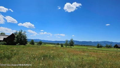 Beautiful custom home site overlooking Hole 7 of the Hale Irwin on Teton Reserve in Idaho - for sale on GolfHomes.com, golf home, golf lot