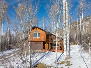 Tucked among the aspen and pines in Star Valley Ranch, this on Star Valley RV Golf Course in Wyoming - for sale on GolfHomes.com, golf home, golf lot