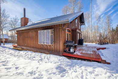 Tucked among the aspen and pines in Star Valley Ranch, this on Star Valley RV Golf Course in Wyoming - for sale on GolfHomes.com, golf home, golf lot
