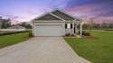 This two-story plan boasts a luxurious primary bedroom upstairs for sale in Manning South Carolina Clarendon County County on GolfHomes.com