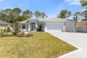 Welcome home to this like new construction, custom built by for sale in Palm Coast Florida Flagler County County on GolfHomes.com