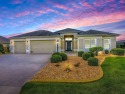 BOND PAID!  STUNNING PREIMIER HOME!  PROFESSIONALLY LANDSCAPED for sale in The Villages Florida Lake County County on GolfHomes.com