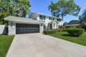 This beautifully updated two-story home is full of charm and for sale in Palm Beach Gardens Florida Palm Beach County County on GolfHomes.com