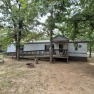 NEAT CLEAN MOBILE ON CORNER LOT LESS THAN A MILE TO LAKE for sale in Eufaula Oklahoma McIntosh County County on GolfHomes.com