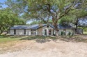 A RARE FIND! Quiet country living in this 4-bed, 3-bath CUSTOM for sale in Whitney Texas Hill County County on GolfHomes.com