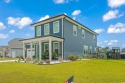 This immaculate 2 story 5 bedroom 3 full bathroom home was for sale in Murrells Inlet South Carolina Horry County County on GolfHomes.com