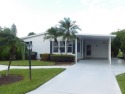 PRICE REDUCED ! 2 bedroom/2 bath on the golf course with a water for sale in Port Saint Lucie Florida Saint Lucie County County on GolfHomes.com