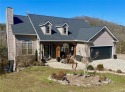 The cobblestone drive and walkway set the tone for this home's, Arkansas