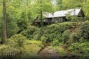 Discover this Holly Forest home in a one-of-a-kind setting with for sale in Sapphire North Carolina Jackson County County on GolfHomes.com