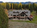 Leave the world behind at this lakefront estate perched on the for sale in Eureka Montana Lincoln County County on GolfHomes.com