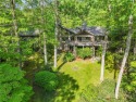 Nestled amidst the serene beauty of the Western North Carolina for sale in Cashiers North Carolina Jackson County County on GolfHomes.com