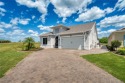 Seated on the most exceptional lot in this 55+ Community, this for sale in Kissimmee Florida Osceola County County on GolfHomes.com