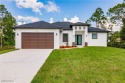 Discover a home that combines modern elegance and practical for sale in Lehigh Acres Florida Lee County County on GolfHomes.com