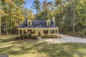 Custom built Cape Cod style home with a private back yard and for sale in Monticello Georgia Jasper County County on GolfHomes.com