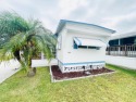 This home is located in a 55+ community in the back of the park for sale in Lakeland Florida Polk County County on GolfHomes.com