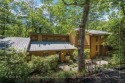 Nestled at the end of a quiet cul-de-sac in The Woods, this for sale in Sapphire North Carolina Jackson County County on GolfHomes.com
