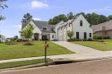 Experience resort-style living in this exceptional residence for sale in Madison Mississippi Madison County County on GolfHomes.com