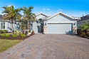 This highly sought after *Expanded* Summerwood floor plan by for sale in Estero Florida Lee County County on GolfHomes.com