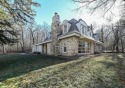 Your cottage in the woods awaits! Nestled on a 3-acre wooded lot for sale in Dousman Wisconsin Waukesha County County on GolfHomes.com