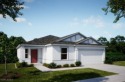 Step into your dream home with The Ashton, where modern living for sale in Lehigh Acres Florida Lee County County on GolfHomes.com