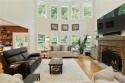 This custom-built home sits on a roundabout cul-de-sac nestled for sale in Cumming Georgia Forsyth County County on GolfHomes.com