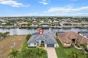 Highly desirable Gulf access home in Southwest Cape Coral, fully for sale in Cape Coral Florida Lee County County on GolfHomes.com