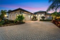This exquisite home epitomizes elegance. Enter through the iron for sale in Lakewood Ranch Florida Manatee County County on GolfHomes.com