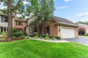 Nestled along a picturesque golf course and completely updated for sale in Brighton Michigan Livingston County County on GolfHomes.com