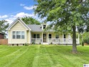 Perfectly positioned across from the golf course, this charming for sale in Elizabethtown Kentucky Hardin County County on GolfHomes.com