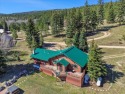 Welcome to The Great Escape, a desirable 3BR/2BA alpine home for sale in Taos New Mexico Taos County County on GolfHomes.com