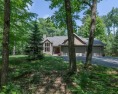 This stunning contemporary multi-level 4BR/4BA home in peaceful for sale in Minocqua Wisconsin Oneida County County on GolfHomes.com