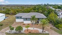 Welcome to 1379 Albatross Road, a private tropical retreat for sale in Sanibel Florida Lee County County on GolfHomes.com
