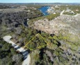 Imagine a wooded, tranquil setting right on the water's edge for sale in Possum Kingdom Lake Texas Palo Pinto County County on GolfHomes.com