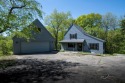 This Branigar farmhouse-style home is set on a beautiful, wooded for sale in Galena Illinois Jo Daviess County County on GolfHomes.com