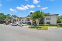 Welcome home to this beautiful ground floor corner condominium for sale in Palm Harbor Florida Pinellas County County on GolfHomes.com