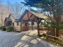 Nestled in a serene, wooded setting, this charming home offers for sale in Sapphire North Carolina Jackson County County on GolfHomes.com