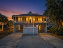 Discover the ultimate coastal retreat in this stunning custom for sale in Edisto Island South Carolina Colleton County County on GolfHomes.com