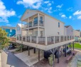 This beautiful 5 bedrooms and 4.5 baths raised beach house is in for sale in Myrtle Beach South Carolina Horry County County on GolfHomes.com