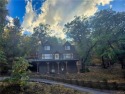 Tucked beneath majestic oaks and pines, this 3 bedroom, 2 bath for sale in Big Bear City California San Bernardino County County on GolfHomes.com