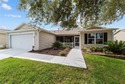 Located in the highly desirable Village of Caroline in The for sale in The Villages Florida Lake County County on GolfHomes.com