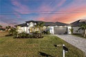 Modern Gulf Access Pool Home overlooking a wide canal near the 7 for sale in Cape Coral Florida Charlotte County County on GolfHomes.com