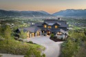 Perched atop a prominent ridgeline, this stunning residence is for sale in Heber City Utah Wasatch County County on GolfHomes.com