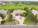 This sprawling home spans 6900 sq ft showcasing stunning views for sale in Colorado Springs Colorado El Paso County County on GolfHomes.com