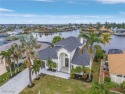 ELEVATION, LOCATION, BEAUTY! This GULF ACCESS 4 bed/5 bath 3,208 for sale in Cape Coral Florida Lee County County on GolfHomes.com