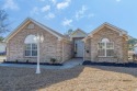 Stunning all-brick home on a serene pond adjacent to Eagles Nest for sale in Little River South Carolina Horry County County on GolfHomes.com