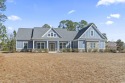 This stunning custom farmhouse-style home sits on a spacious 0 for sale in Conway South Carolina Horry County County on GolfHomes.com