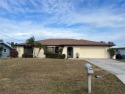 YOUR TROPICAL PARDISE AWAITS.   This spacious 2 bed 2 bath gulf for sale in Port Charlotte Florida Charlotte County County on GolfHomes.com