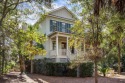 Nestled on Mallard Lake, this exquisite Lowcountry-style home for sale in Seabrook Island South Carolina Charleston County County on GolfHomes.com