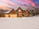 This stunning brick colonial masterpiece sits on a large for sale in Farmington Hills Michigan Oakland County County on GolfHomes.com