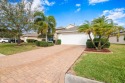 Upon entering this beautiful residence, attention is drawn to for sale in Palm Bay Florida Brevard County County on GolfHomes.com
